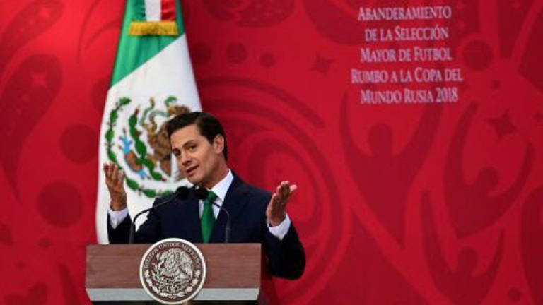 Mexico turns page on handsome, scandal-stained president