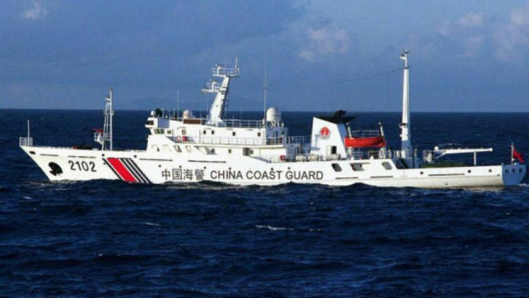 Japan to bolster patrols near disputed isles