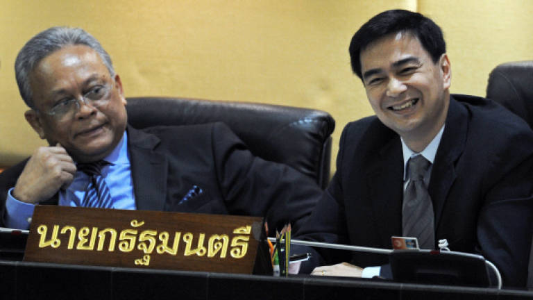 Thai court drops murder charge against ex-PM Abhisit
