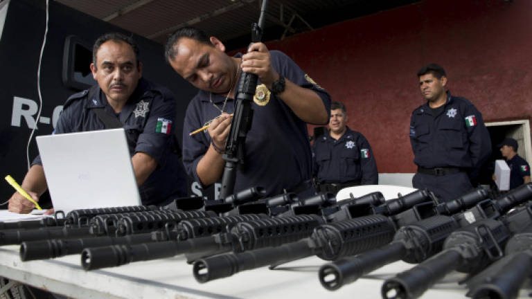 Mexico turns anti-cartel vigilantes into police force