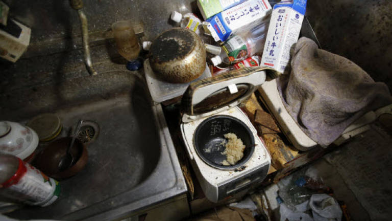 Clean-up crew on hand to spruce up Japan's 'lonely death' apartments