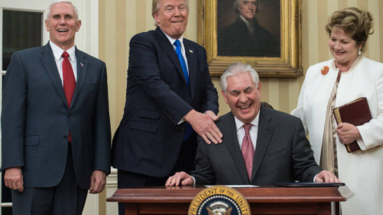 Tillerson takes charge of restive State Department