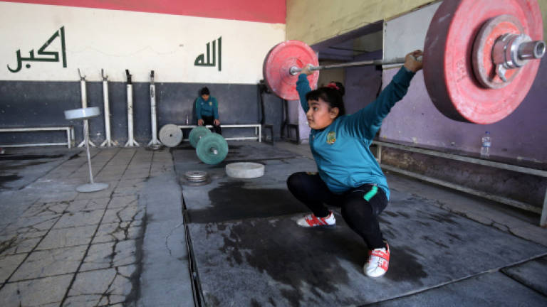 Iraq's girl weightlifters also boost family finances