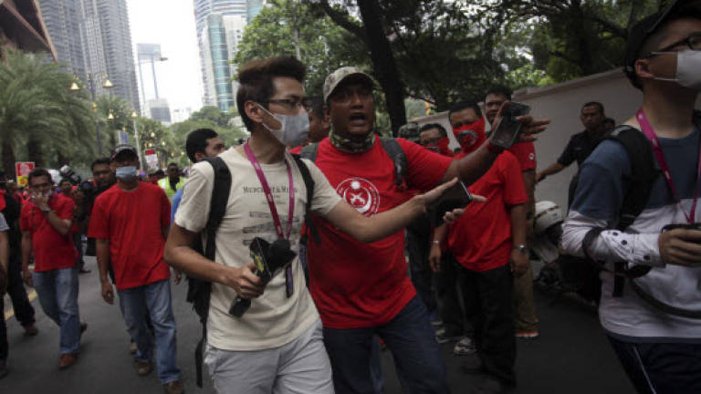 Chinese reporters escorted out from red shirt rally as situation intensifies