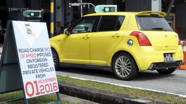 Singaporeans carpool as RM20 road charge kicks in