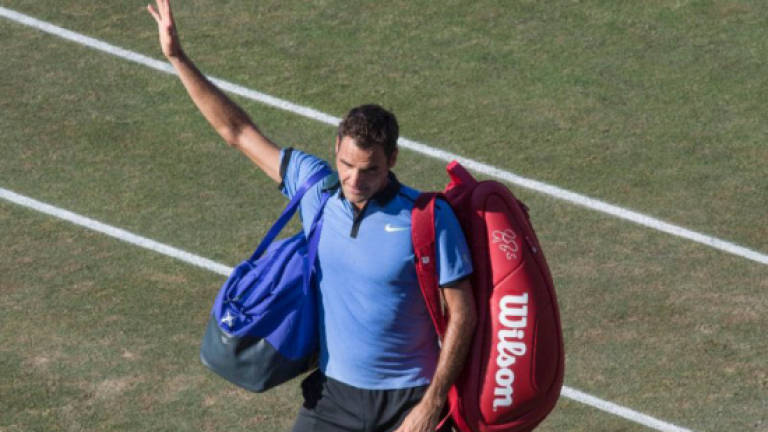 Federer fine tunes Wimbledon assault in Halle