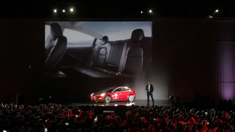 Tesla begins to deliver model for the masses (Video)