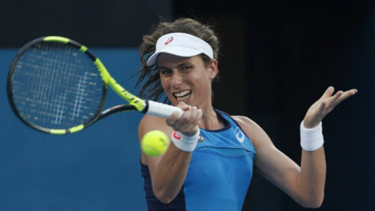 Konta overwhelms Radwanska in Sydney WTA final