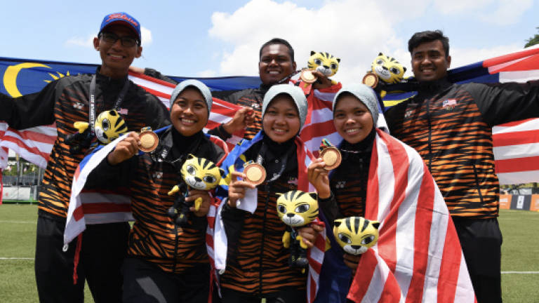 M'sia grab two golds from men's and women's recurve teams