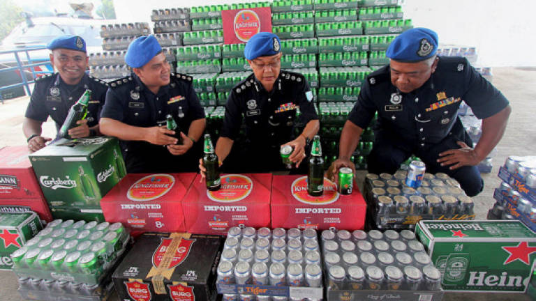 Father, son nabbed for masterminding liquor smuggling
