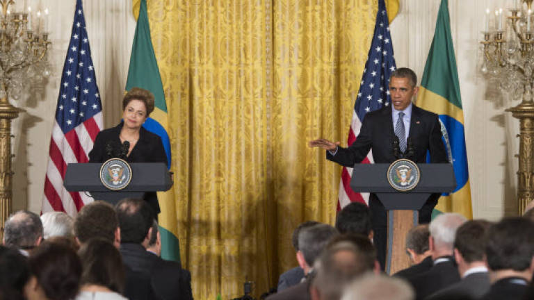Obama and Rousseff focus on climate, play down spy row