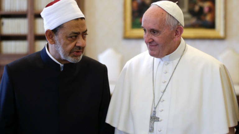 Pope and top imam embrace in historic Vatican meeting
