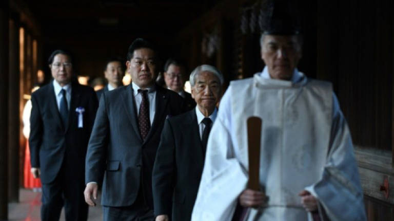 Dozens of Japan MPs visit controversial war shrine
