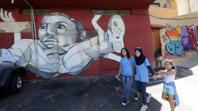 Street art brings colour to rundown Beirut suburb