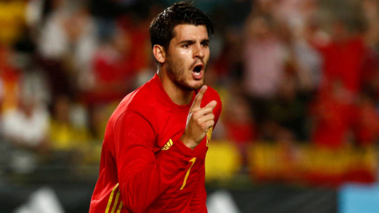 Morata saves Spain in four-goal Colombia thriller
