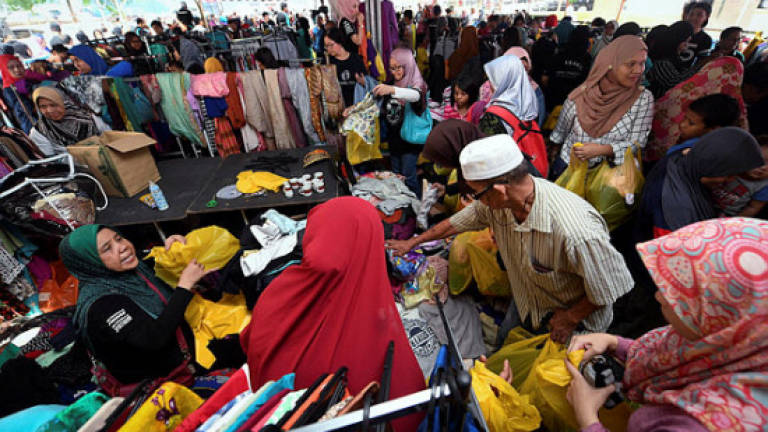 Socso does its bit by getting raya clothes for 12 orphans