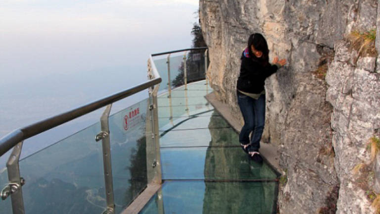 Don't look down: glass bottom skywalk thrills in China