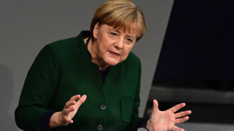 Merkel 'not happy' Trump scrapping Pacific trade deal