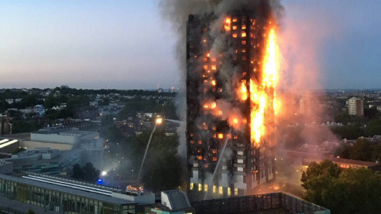 At least 12 dead in London tower block fire