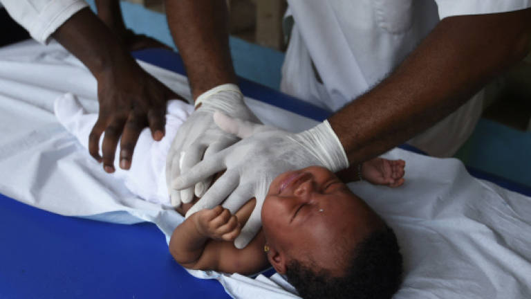 Massage gives infants breath of life in Ivory Coast