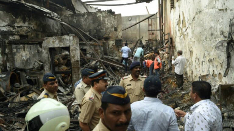 Fire and collapse in Mumbai shop kills 12