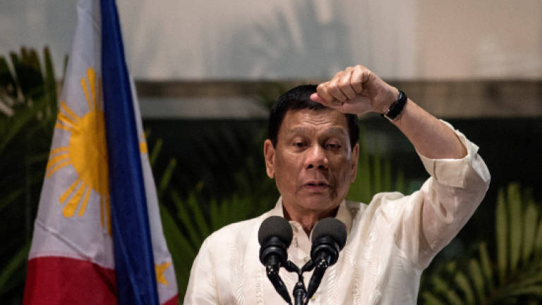 Philippines' Duterte threatens top newspaper, broadcaster