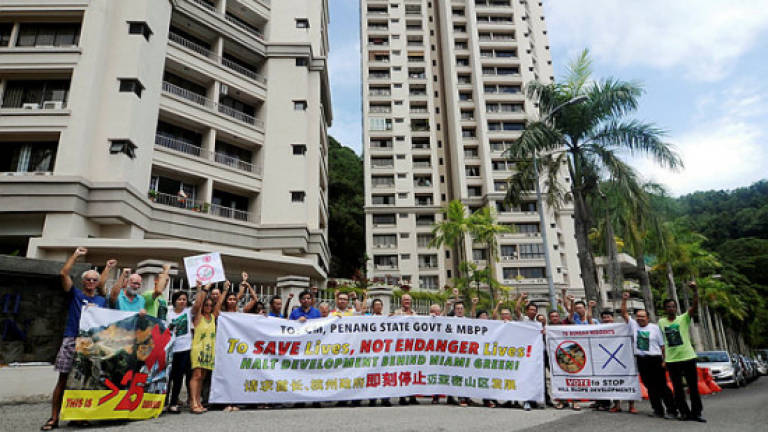 Stop turning blind eye to hill slope development, Penang govt told