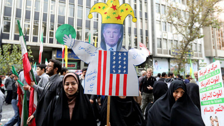 Thousands of Iranians protest against Trump