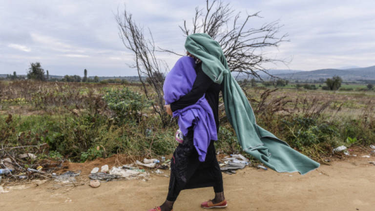 EU calls mini summit as Balkans buckle under refugee crisis