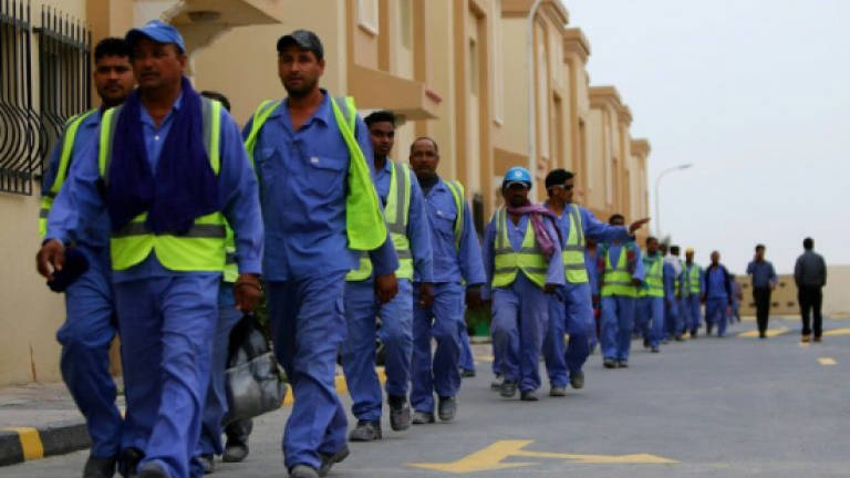 Qatar workers face old problems despite reform promises