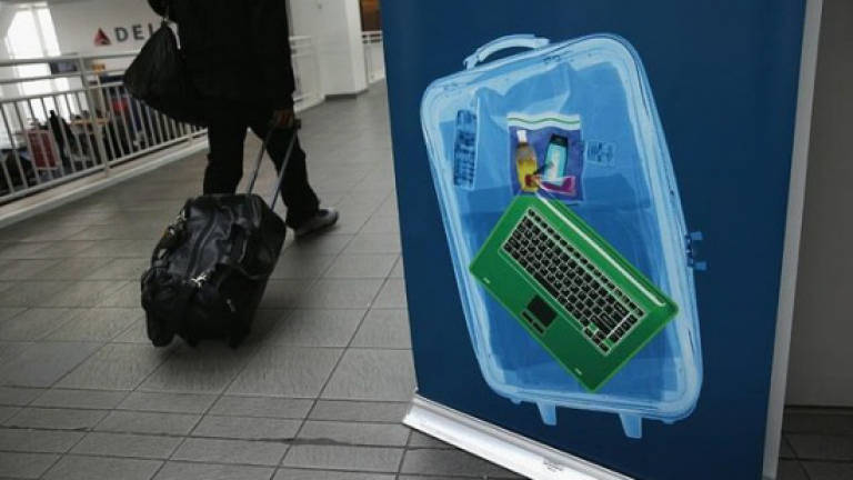 EU demands talks with US over possible airline laptop ban