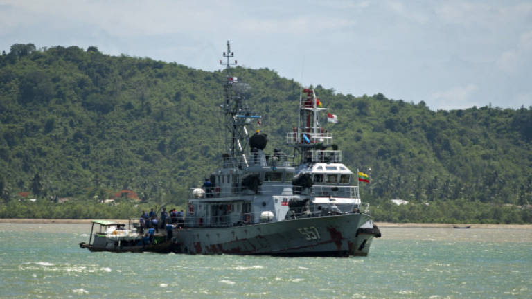 Myanmar navy stops reporters approaching migrant island