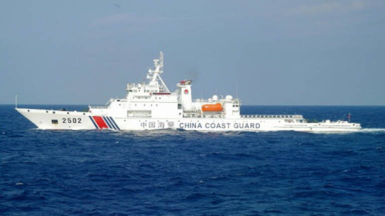 China ships sail near disputed islands: Japan