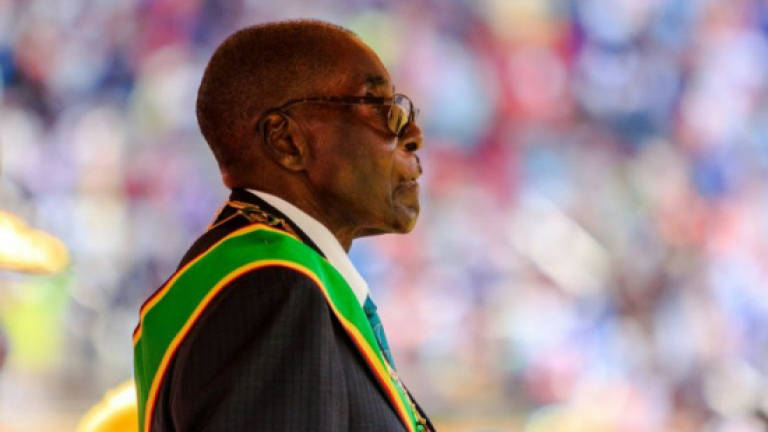 93-year-old Mugabe says 'not dying' as health concerns mount
