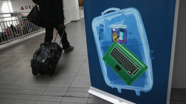 EU, US hold 'robust' talks on possible airline laptop ban