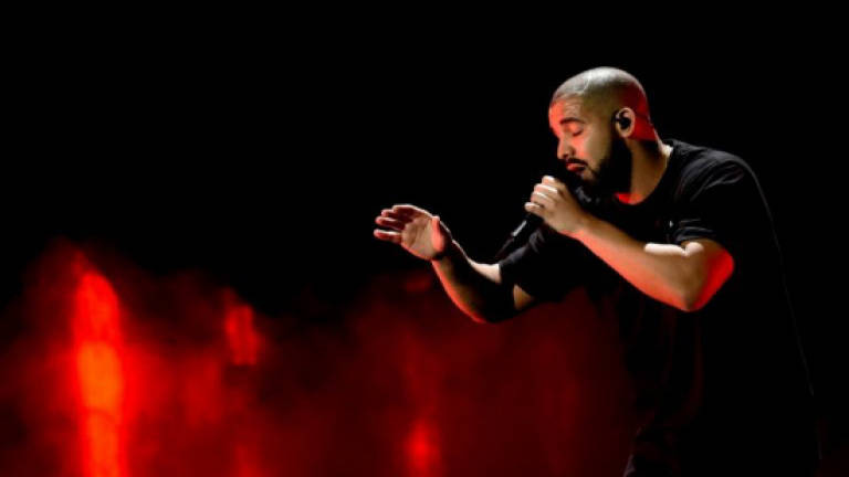 Drake, reigning on singles chart, announces album