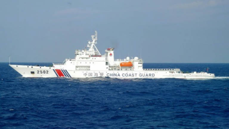 Chinese ships sail near disputed islands with Japan