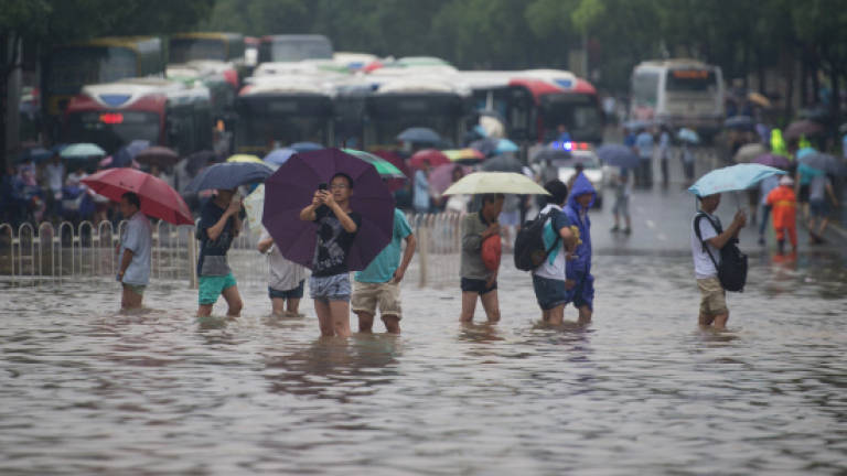More than 120 dead in China floods (Updated)