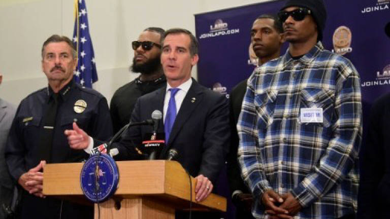 Rappers Snoop Dogg, The Game protest outside LA police HQ