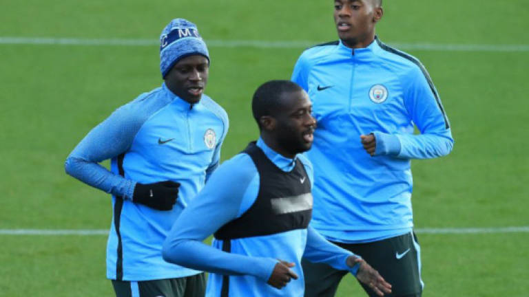 Pep challenges Toure to win back City place