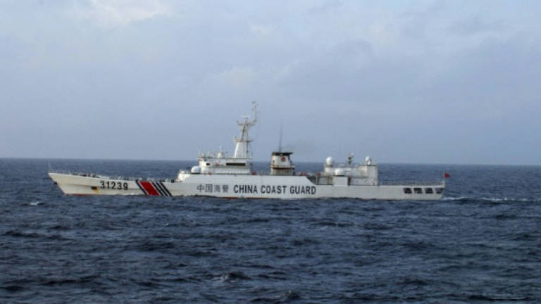 Japan protests as China ships sail near disputed isles