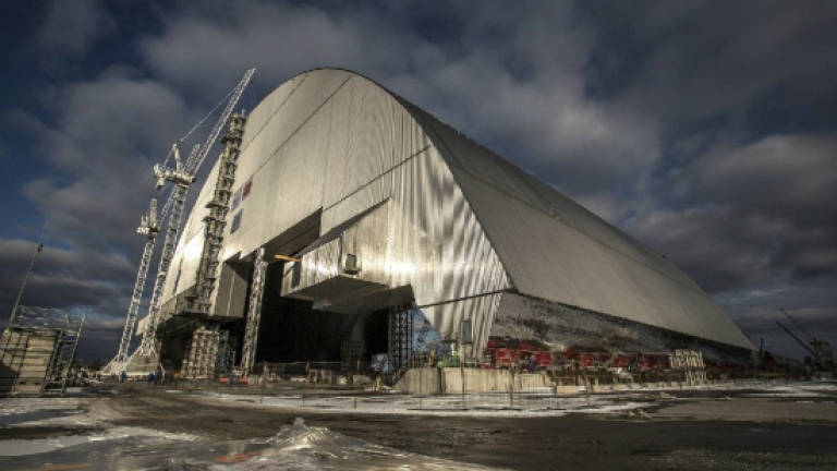 Ukraine moves new safety dome over Chernobyl's doomed reactor