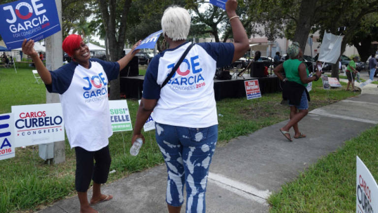 Voter turnout 'explodes' among blacks, Hispanics in US