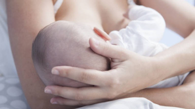 Breastfeeding benefits babies born to obese mothers