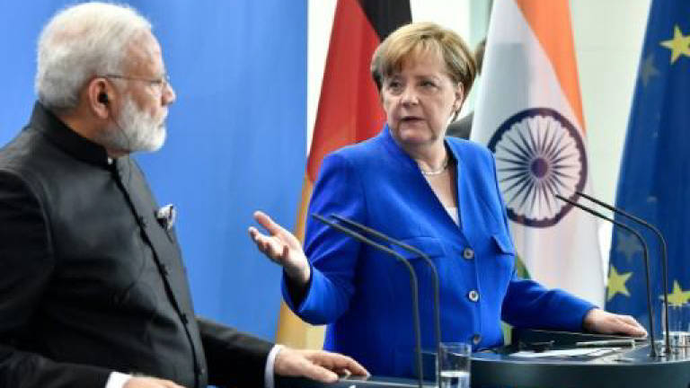 Europe must step up as diplomatic player: Merkel
