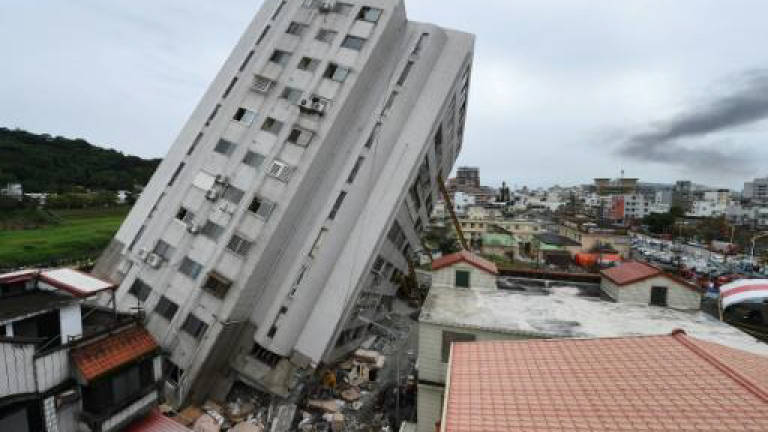 Taiwan quake toll rises to 14 as bodies pulled from rubble
