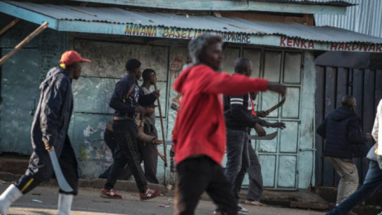 Kenya gripped by tension as Kenyatta leads in disputed poll
