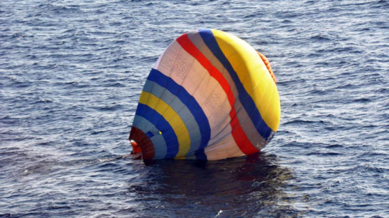 Japan coastguard rescues Chinese balloonist trying to reach islands