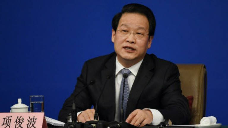 Ex-head of China insurance regulator pleads guilty to bribes