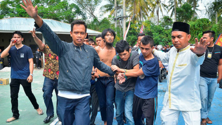 Escaped prisoners returned to overcrowded Indonesia jail